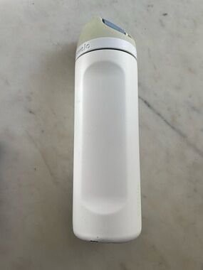Owala White Insulated Water Bottle with Pale Yellow and Light Blue Lid
